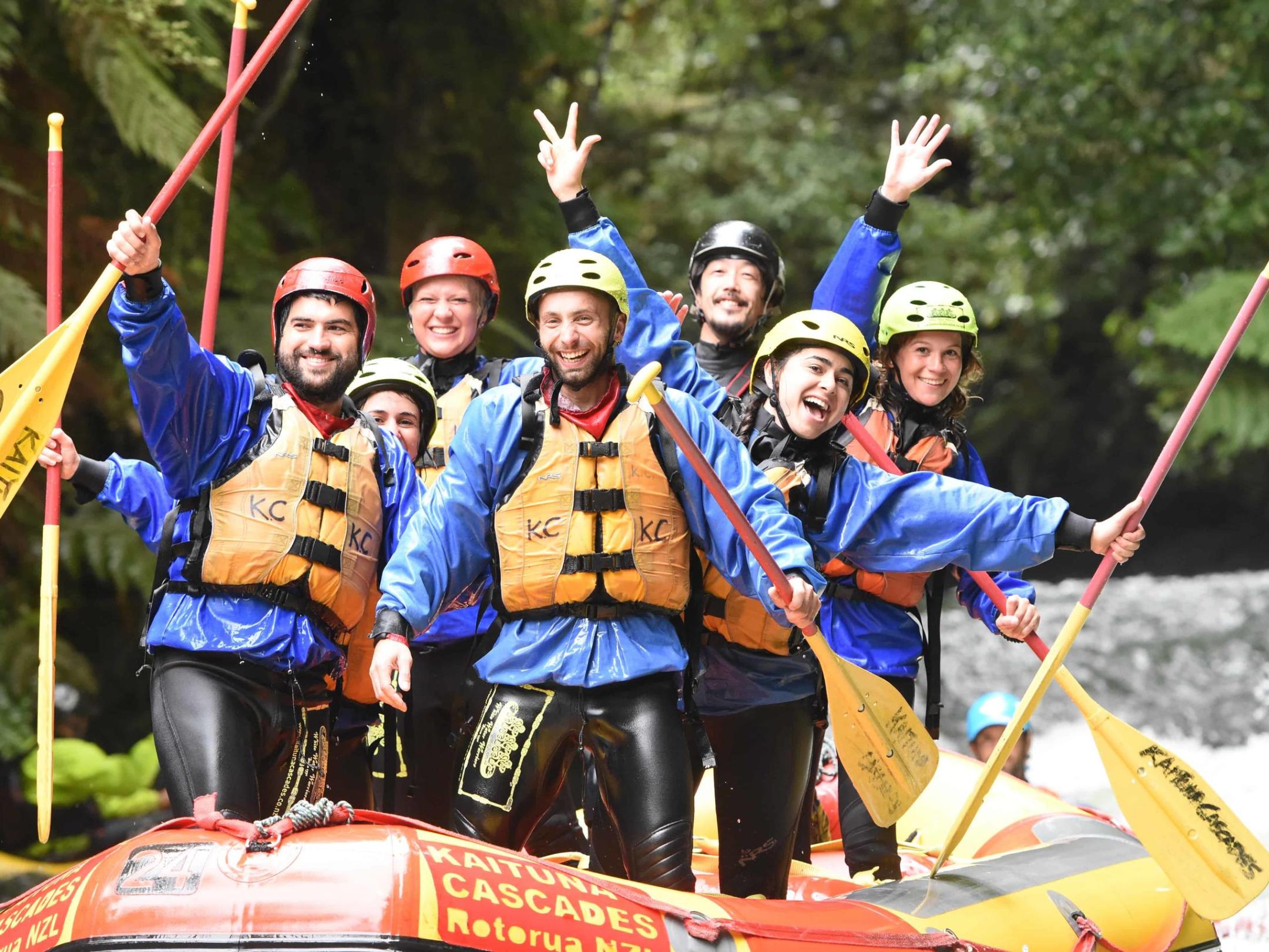 a group of people riding on the back of a boat