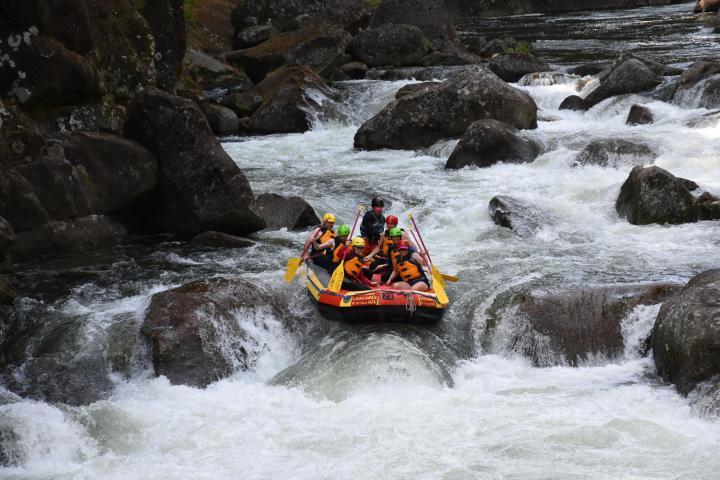 a large waterfall over a body of water