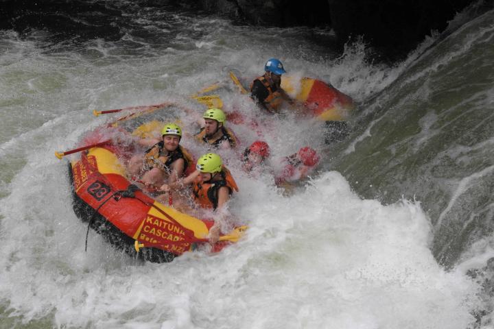 a man riding a wave on a surfboard in the water