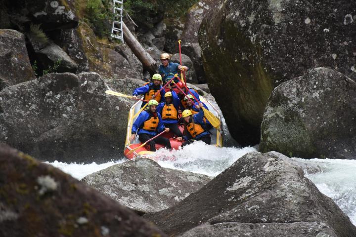 a man riding on top of a rock