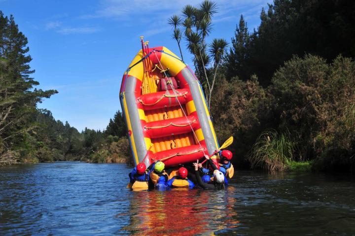 a person riding on a raft in a body of water