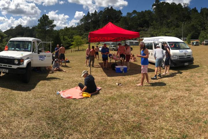 a group of people that are standing in the grass